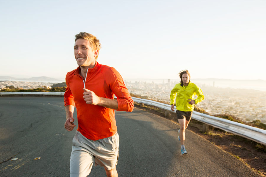 two young happy men running