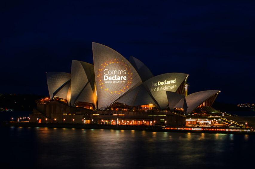 A photograph of the Comms Declare logo project on the Sydney Opera House