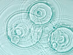 Blue water texture, blue mint water surface with rings and ripples