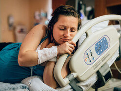 A pregnant mom in the hospital in labor, stages of labor