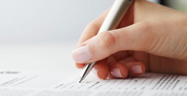 FilingForm Businesswoman writing on a form