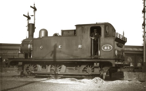 No. 85 from the P57 batch was released to traffic on 16 September 1904. The disc headcode on the bunker reveals the loco has recently brought a Down empty coaching stock (ECS) movement from Liverpool Street to the Stratford Carriage Sidings. Yet another filthy loco, though there's been a half-hearted attempt to buff up the shiny y bits.