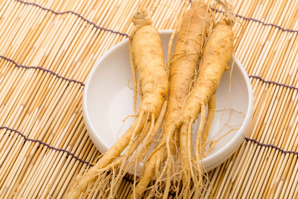 a fresh ginseng in a white bowl, good for ED