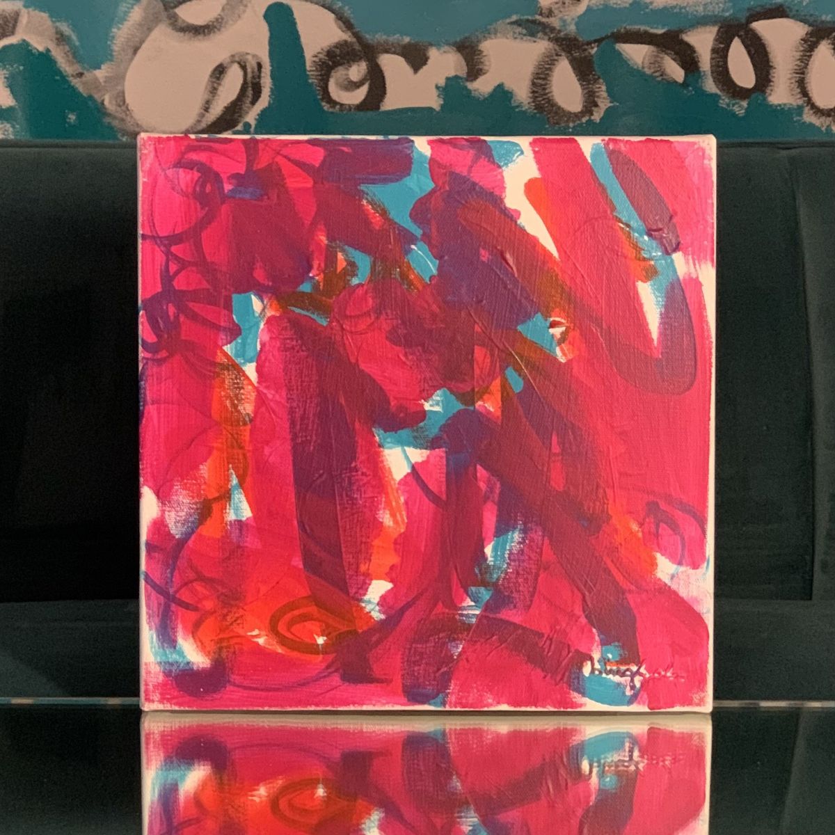 Abstract painting with bold pink, red, and teal marks titled Desire by Beth Inglish.