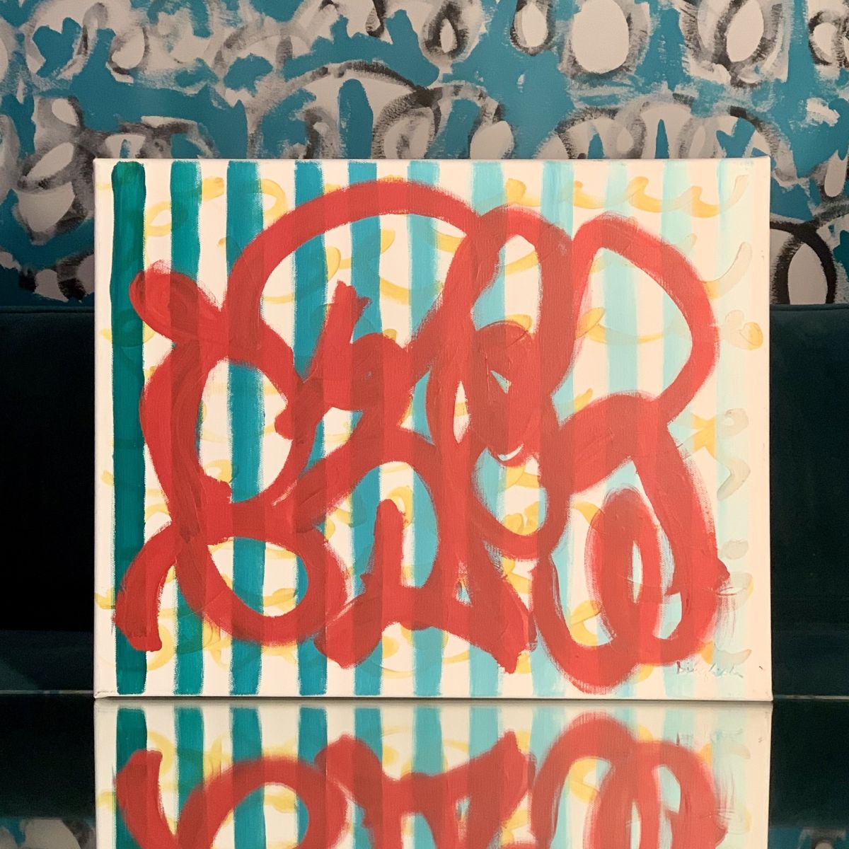Abstract painting with bold red looping marks over teal stripes, created on camera during a healing documentary by artist Beth Inglish.