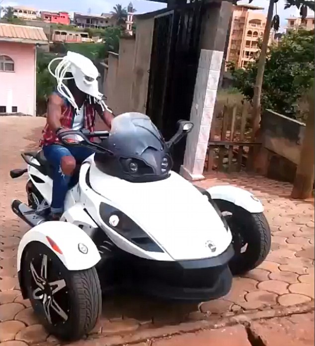 Alex Song wears bizarre Predator mask