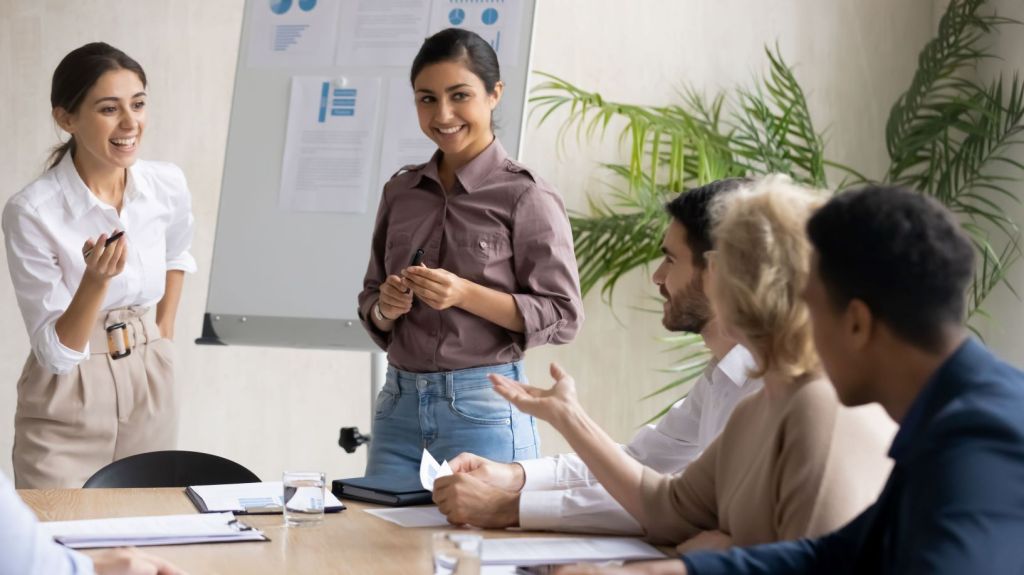 Educator giving a presentation to colleagues during a professional development meeting.