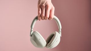 Person holding up the Sony WH-1000XM6