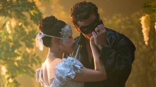 Benedict kisses Sophie's hand at a masquerade ball