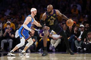 LeBron James #23 of the Los Angeles Lakers dribbles against Alex Caruso #9 of the Oklahoma City Thunder during the fourth quarter in Game Four of the Second Round of the NBA Western Conference Playoffs at Crypto.com Arena on May 11, 2026 in Los Angeles, California (Photo by Luke Hales/Getty Images)