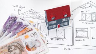 drawing of house with model of house and £20 and £10 notes lying on top of drawing