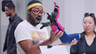 a man is shocked by a sci-fi arm weapon