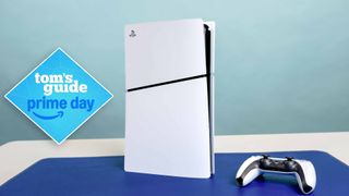 A PS5 Slim console on desk with DualSense controller next to it and Prime Day deal badge overlaid