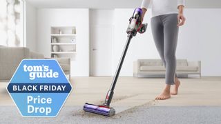 Person using a Dyson V9 Motorbar Cordless Vacuum Cleaner