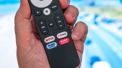Netgem Pleio remote held in hand, showing Freely and Netflix buttons