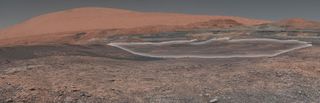 NASA's Mars rover Curiosity has surpassed its 2,000th day on Mars. To celebrate, NASA unveiled this new panorama from Curiosity showing the mound Mount Sharp (which the rover is climbing) and a region of clay materials (highlighted in white) that the rove