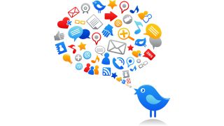 Blue Twitter bird with speech balloon filled with social media and computer icons.