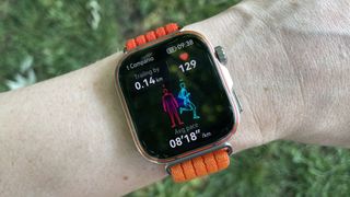 Huawei Watch Fit 5 Pro worn on a run, in front of a grassy background