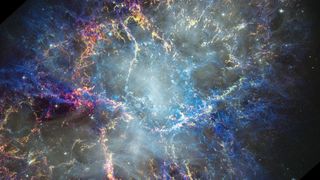 a colorful explosion of tendrils of gas on a black background