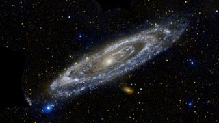 A sparkly bluish galaxy in space.