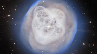 a white orb-shaped cloud of gas on a starry background