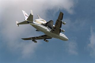 The Space Shuttle orbiter Endeavour flies atop NASA's Boeing 747 Shuttle carrier Aircraft as it returns on March 7, 1997 from a lengthy maintenance period.