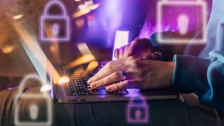Person typing on a laptop with padlock graphics