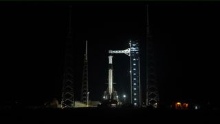 A SpaceX Falcon 9 rocket with the company’s Dragon spacecraft on top stands vertical on the launch pad at Space Launch Complex 40 at Cape Canaveral Space Force Station in Florida on Friday, Feb. 13, 2026, ahead of NASA’s SpaceX Crew-12 launch.