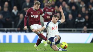 Tottenham Hotspur's Micky van de Ven challenges West Ham United's Jarrod Bowen in a Premier League game