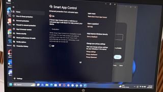 A Windows computer screen displays the Smart App Control settings window, with the Evaluation mode option selected for app protection.