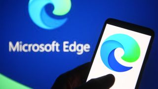 In this photo illustration a Microsoft Edge logo of a web browser developed by Microsoft is seen on a smartphone and a pc screen.