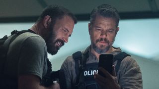 Dane and DJ looking at phone in The Rip