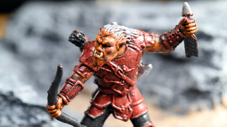 Vancouver, Canada - January 15, 2012: A hobgoblin archer from the Wizards of the Coast tabletop Dungeons and Dragons game, posed on a rocky background.