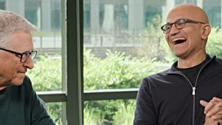 Bill Gates and Satya Nadella listen to Microsoft Copilot on a smartphone