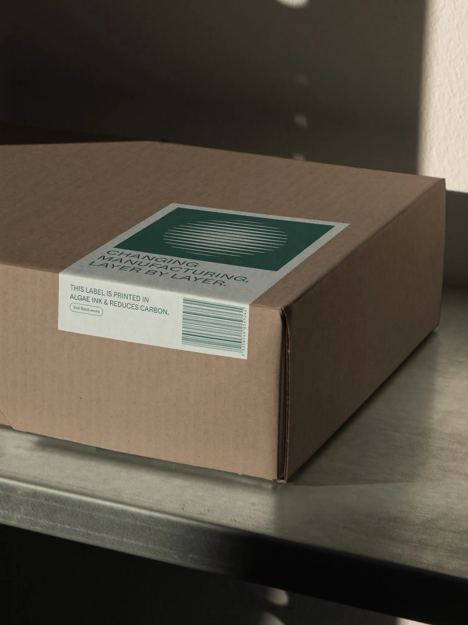A box in the Batch.Works studio with a designed packaging label