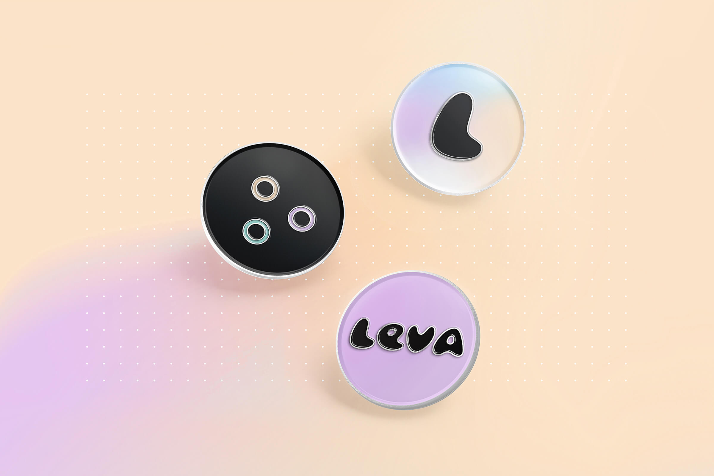 Three Leva pin badges showing the logo and icons