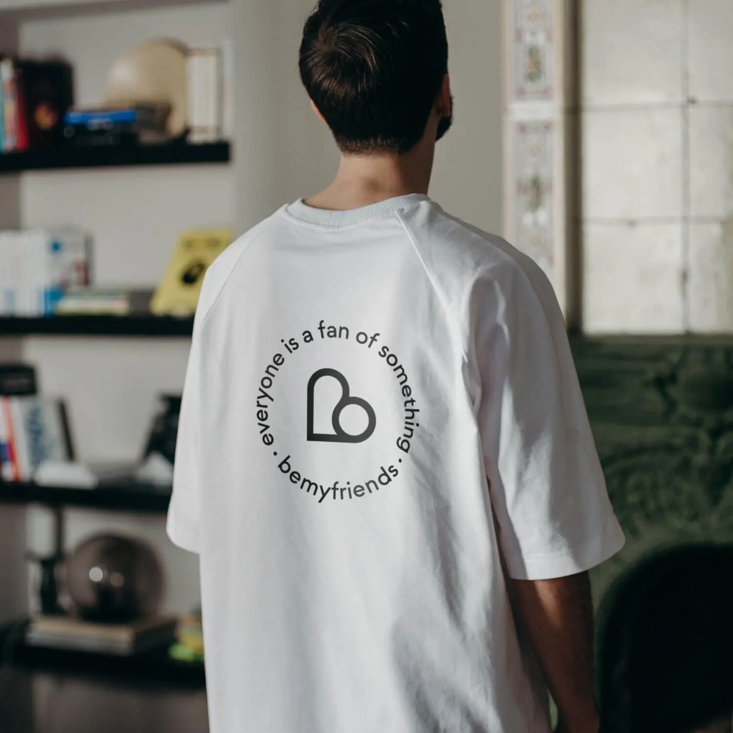 A man wearing Bemyfriends brand t-shirt