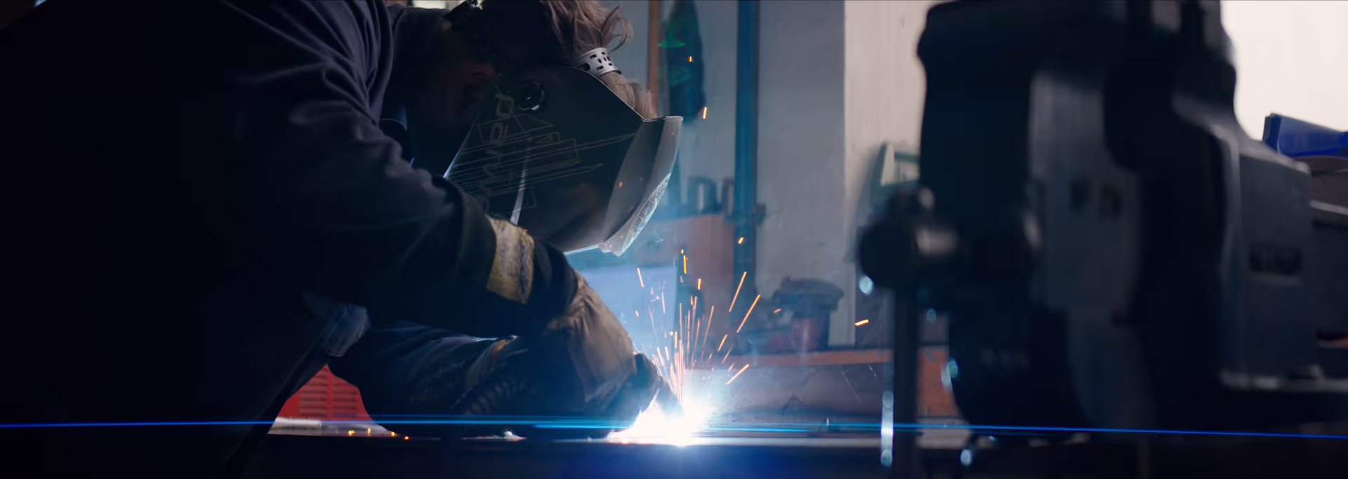 A cutting machine slicing into metal.