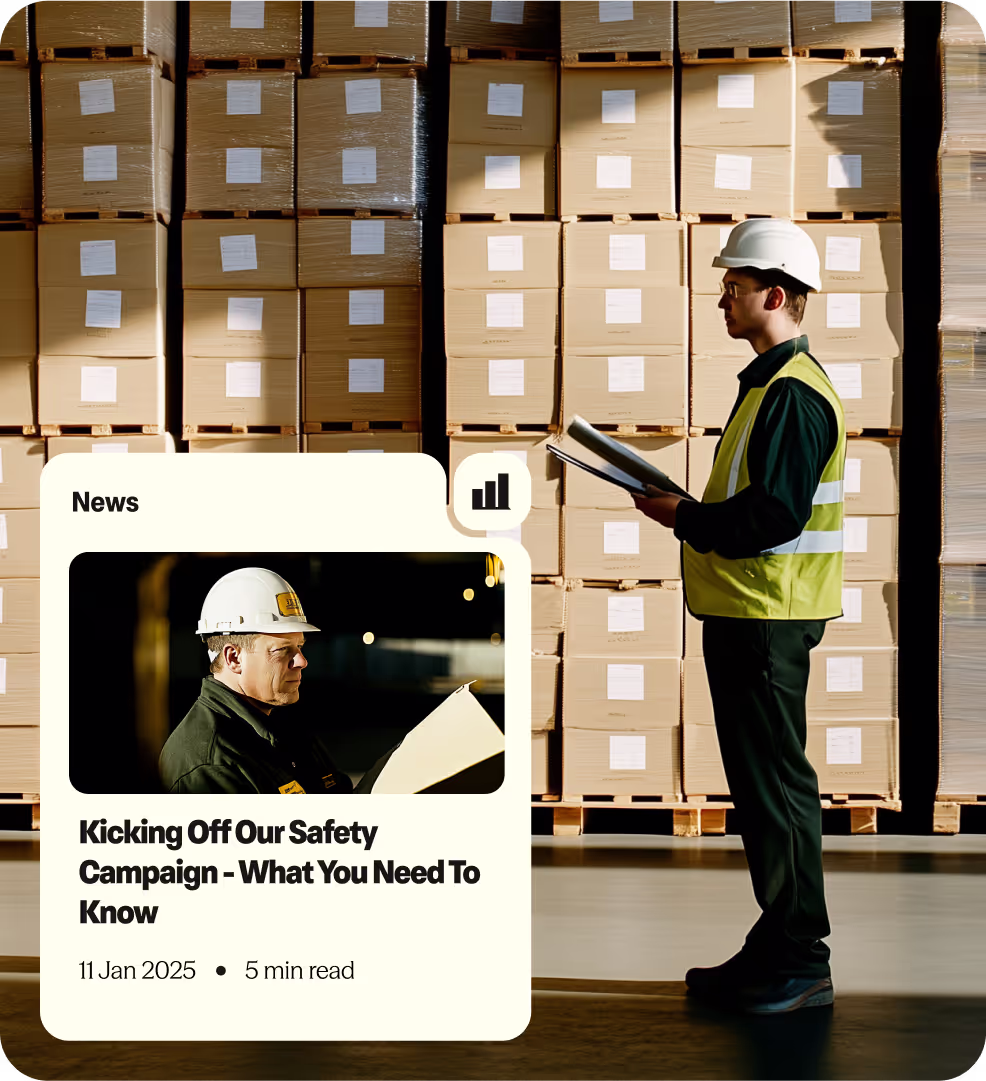 Warehouse worker in a safety vest and helmet inspecting documents in front of stacked cardboard boxes.
