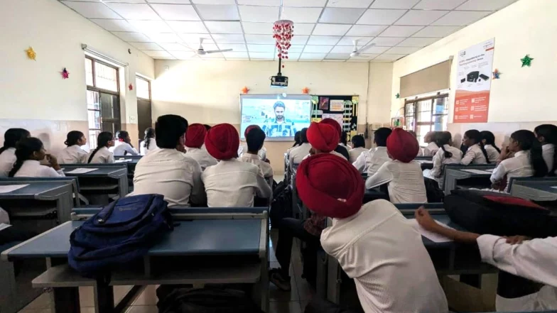 Students watching a documentary film in Punjab, India