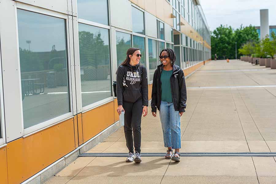 students walking outside of campus