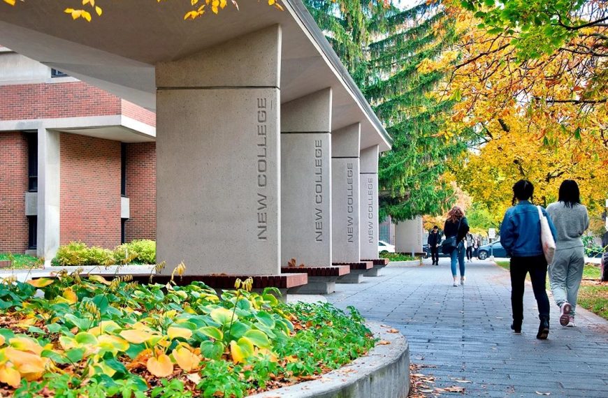 Students walking outside of New College on U of T campus