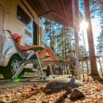 image of woman in chair near rv at campgrounds near hartford, ct.