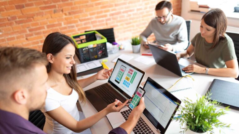 designers drawing website ux app development