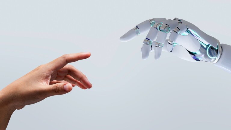 human hand and an AI reaching each other