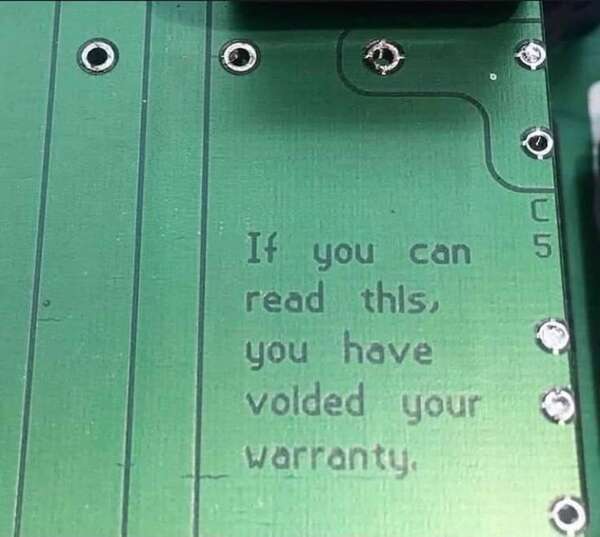 PCB saying with text reading 'if you can read this you have voided your warranty'