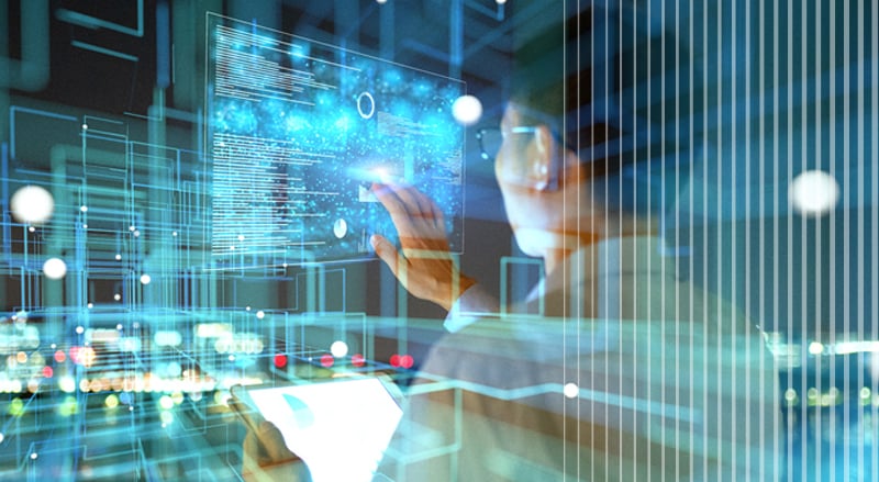 Man with technical data on a monitor