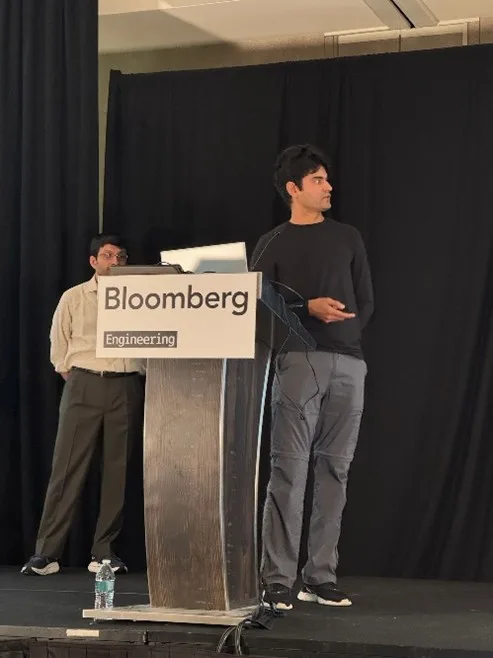 Image of 2 persons standing at a lectern, giving a talk at CppCon