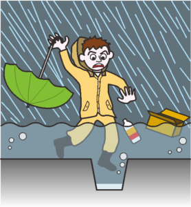 大雨で道路が冠水しているため、側溝に片足を落としそうになっている男性。