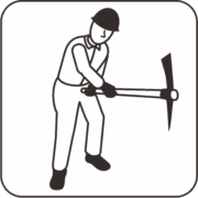 ツルハシを使う建設作業員 ツルハシを使う建設作業員